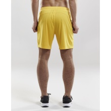 Craft Sporthose (Short) Squad Solid - ohne Innenshort, elastisches Material - gelb Herren