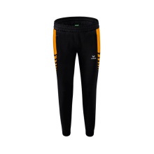 Erima Traingshose Six Wings Worker lang (100% Polyester, sportliche Passform) schwarz/orange Damen
